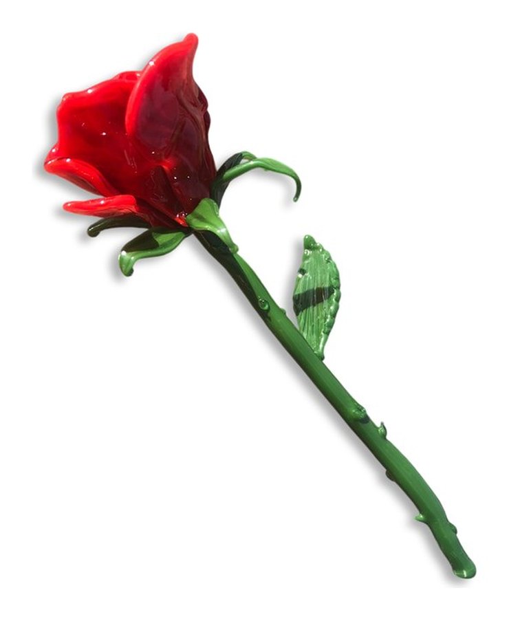 A long-stemmed red glass rose