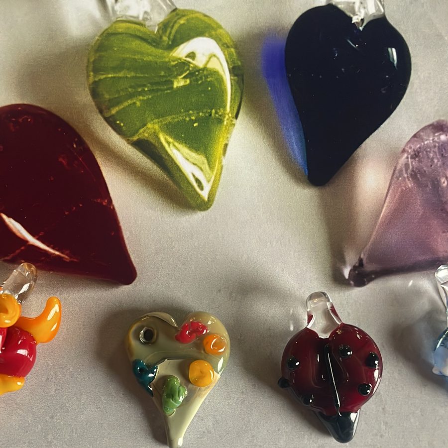 Glass heart pendants in green, black, red, lilac and ladybug designs