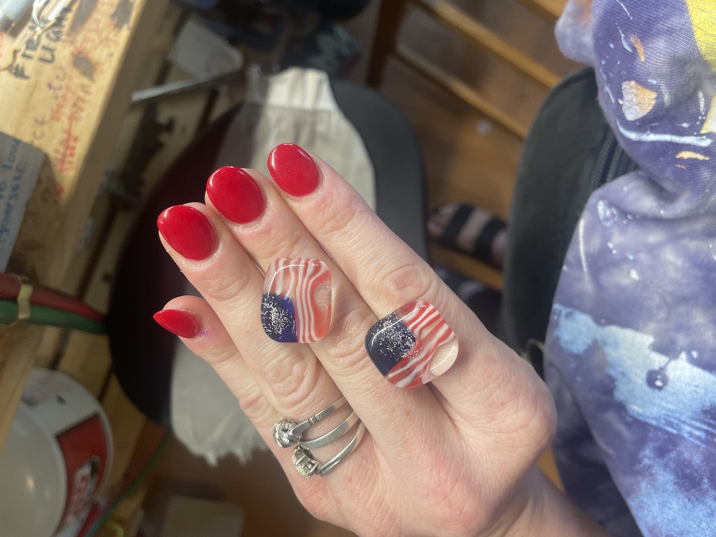 Handmade flag glass pieces worn on the hand in the studio